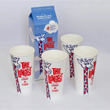 Four white paper cups with red and blue giraffe illustrations and the text 'THE LONGEST DRINK IN TOWN' arranged in front of a blue branded box on a light gray background.